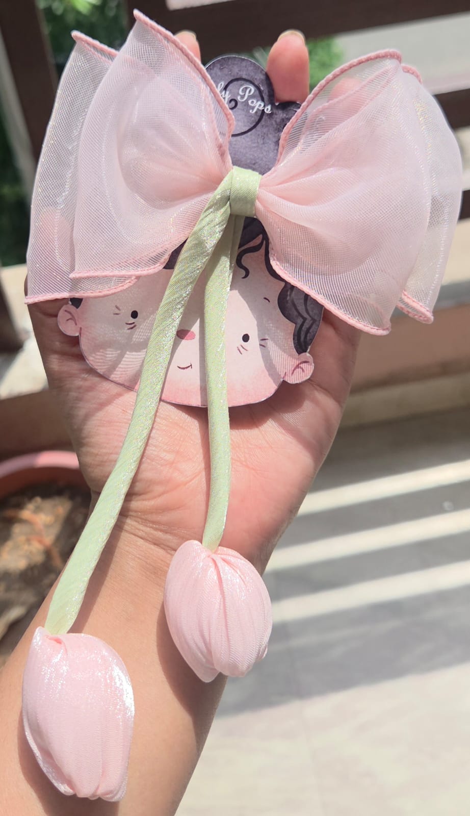 Peach sheer organza aesthetic hair bow clip with a matching fabric tulip flower tassel detail.