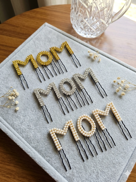 Gold rhinestone, silver crystal and pearl MOM hair comb pins flat lay – baby shower hair accessories all 3 styles