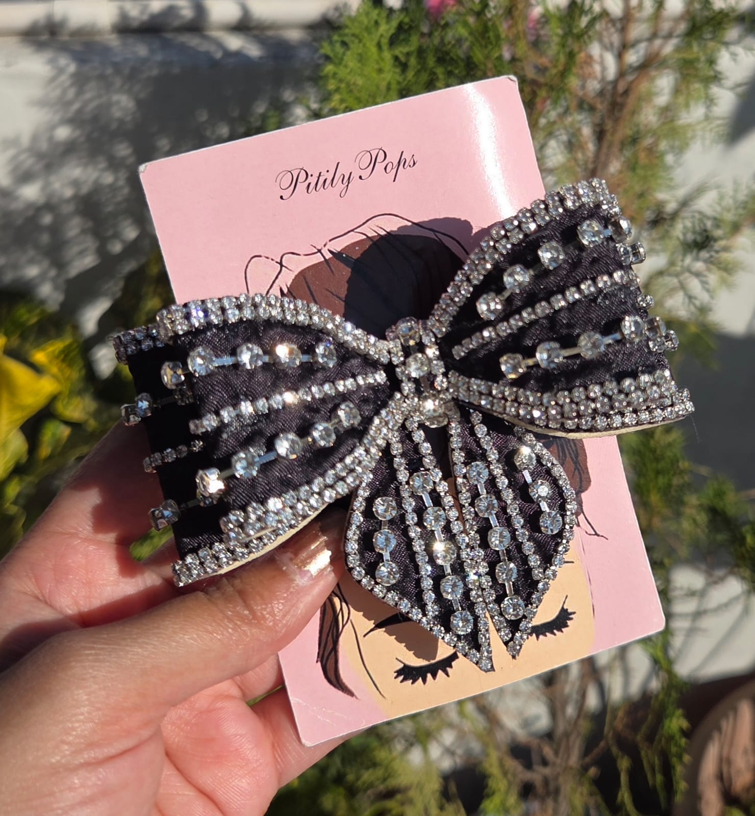 Black luxury rhinestone bow hair clip for women with sparkling crystal detailing and secure buckle clasp for party styling