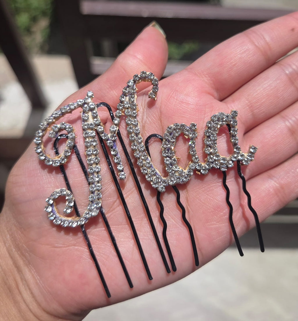 Maa rhinestone crystal hair pin held in palm - sparkling bobby pin for bride, godh bharai and baby shower