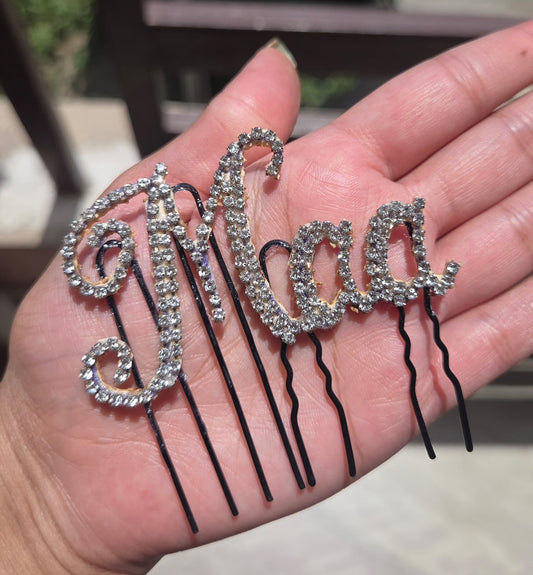 Maa rhinestone crystal hair pin held in palm - sparkling bobby pin for bride, godh bharai and baby shower