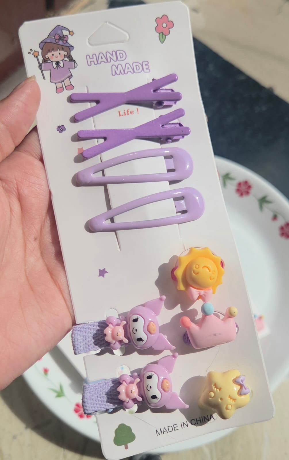 Lavender purple Korean style snap clips card with cute purple cartoon character accents.