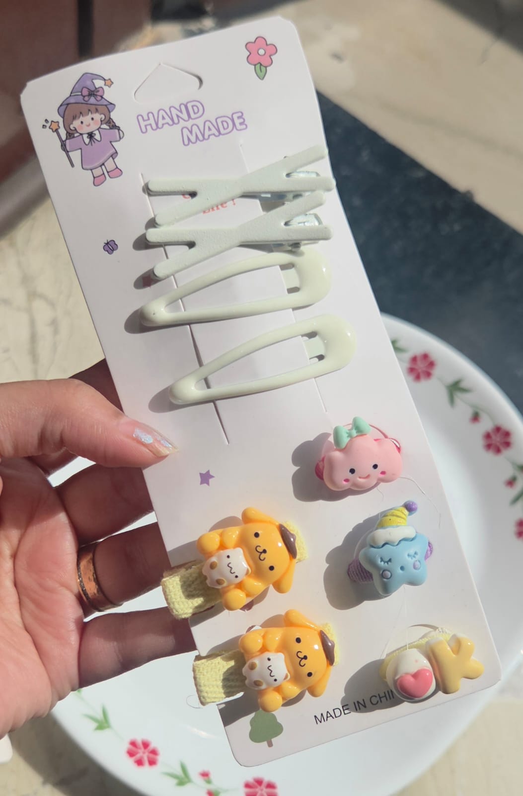 Cream white handmade hair snap clip card showcasing yellow puppy and cloud cartoon charms.