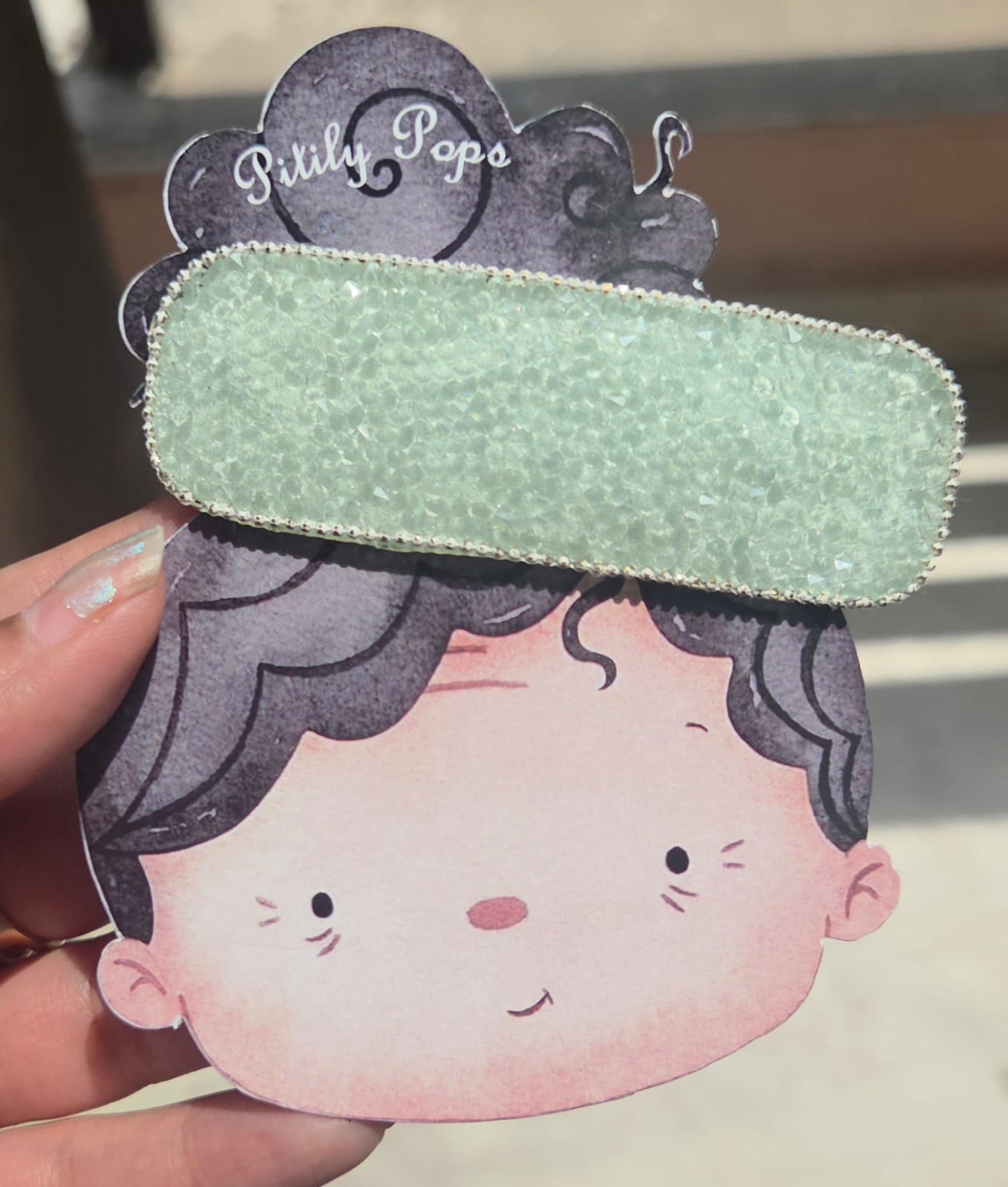 (Mint Shimmer): Close-up view of a sparkly mint green rhinestone rectangle tic tac hair clip with a delicate silver beaded border.