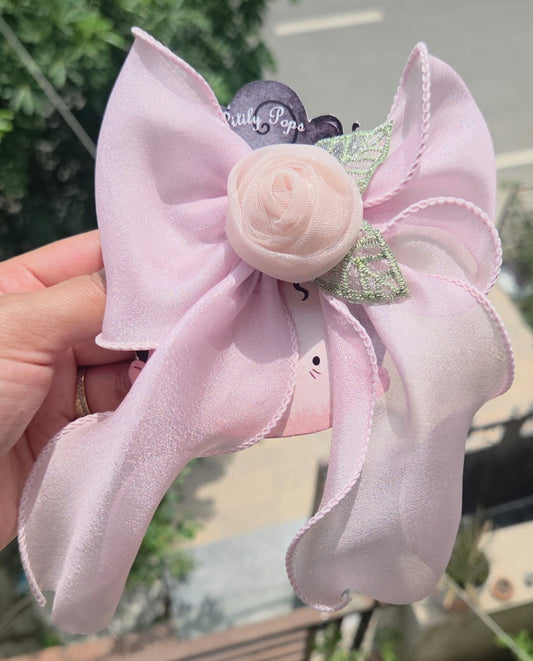 Soft pastel pink organza hair bow with a pink rose center and alligator clip hair accessory.
