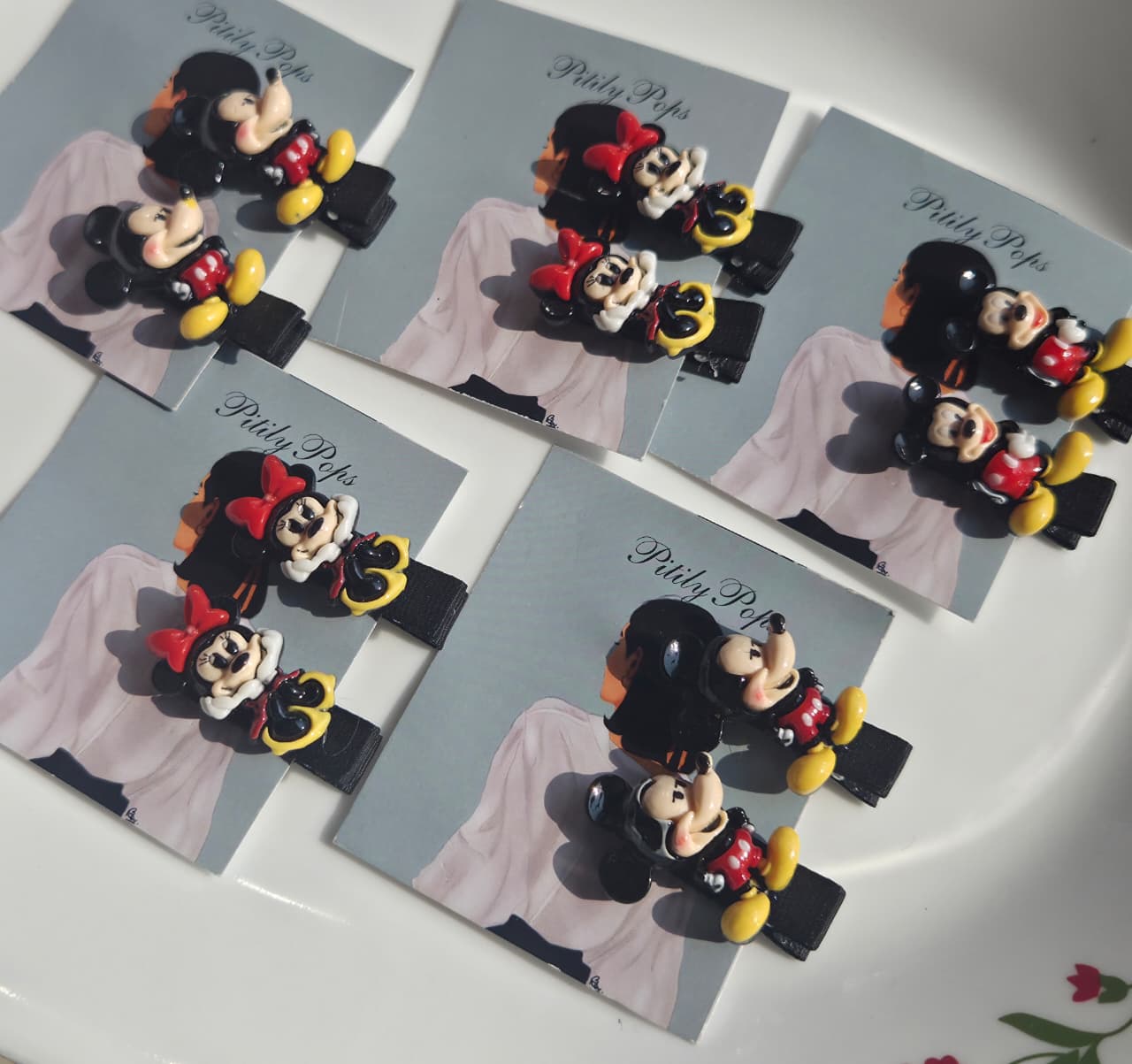 Mickey and Minnie Mouse cartoon character kids hair clips sold in pairs on Pitily Pops display cards