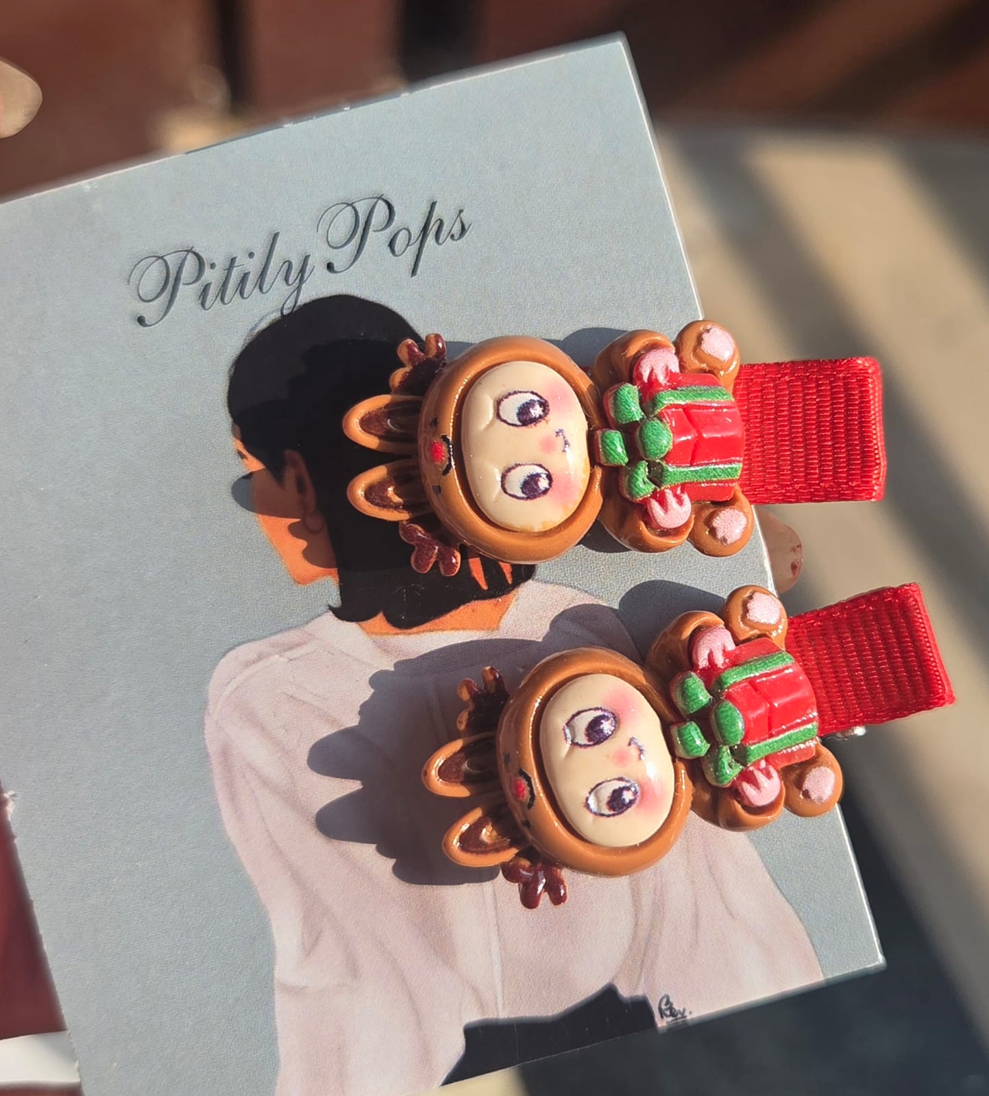 Festive holiday hair accessories for toddlers and girls, showing 6 different Christmas-themed alligator clip designs sold in pairs.