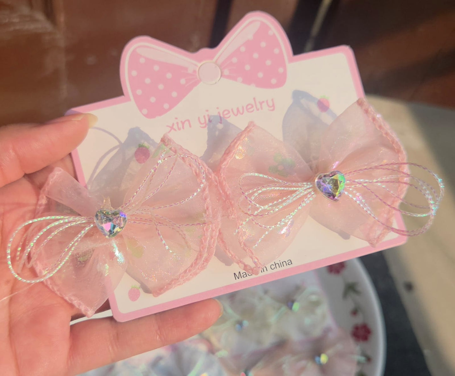Pair of aesthetic peach pink double layered mesh hair bows with sparkly heart gem.