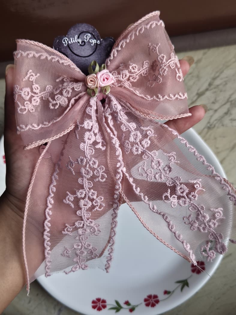 Soft blush pink sheer organza lace hair bow clip featuring dusty pink floral detail

