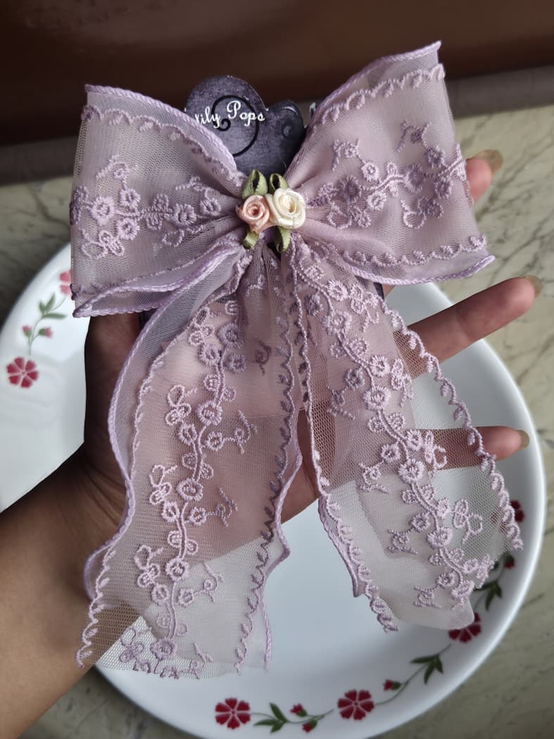 Pastel lilac purple floral lace hair bow clip with long tails and mini rose accent
