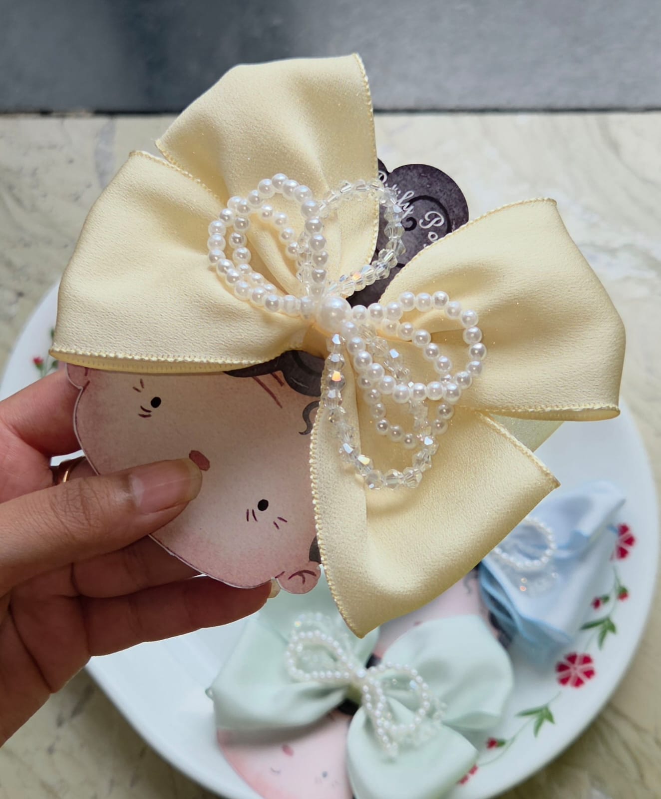 Pastel butter yellow satin hair bow clip with pearl accent
