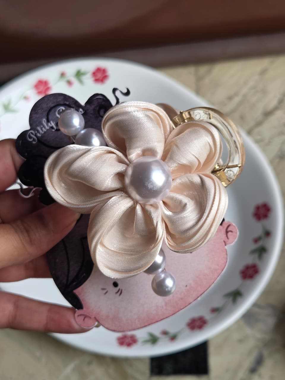    Champagne gold satin fabric floral hair jaw clip with pearl embellishment.
