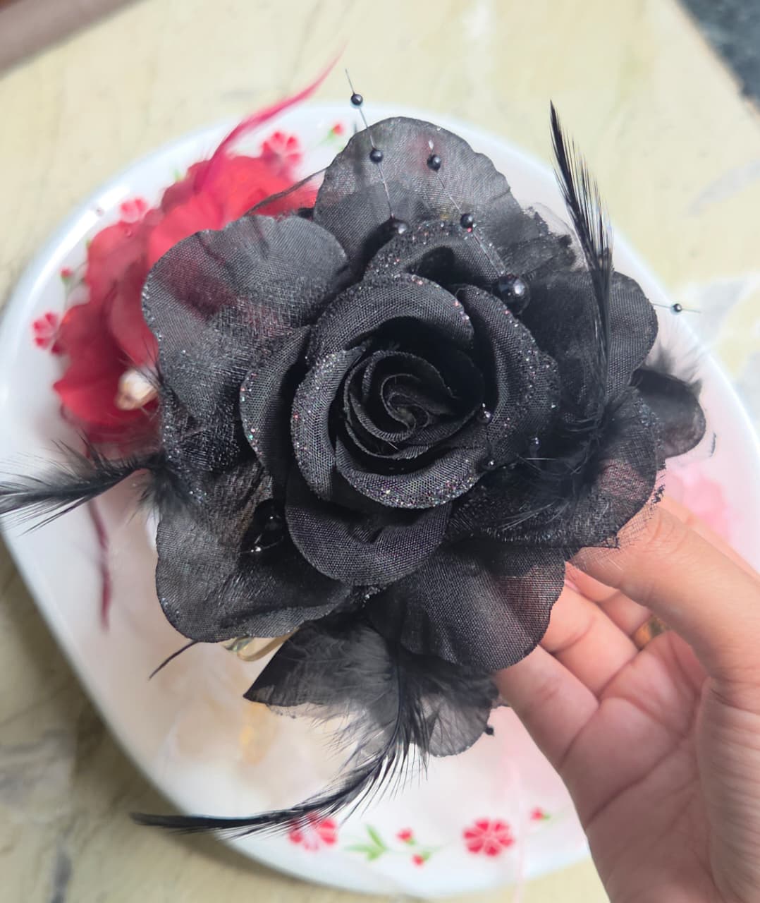    Gothic chic midnight black flower hair claw clip with delicate feather detail.
