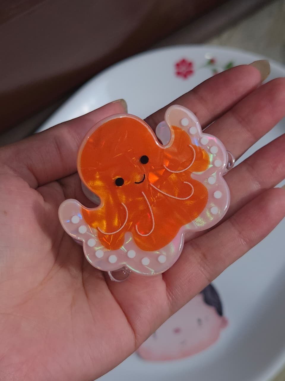    Cute pastel pink and orange octopus hair claw clip with iridescent shine
