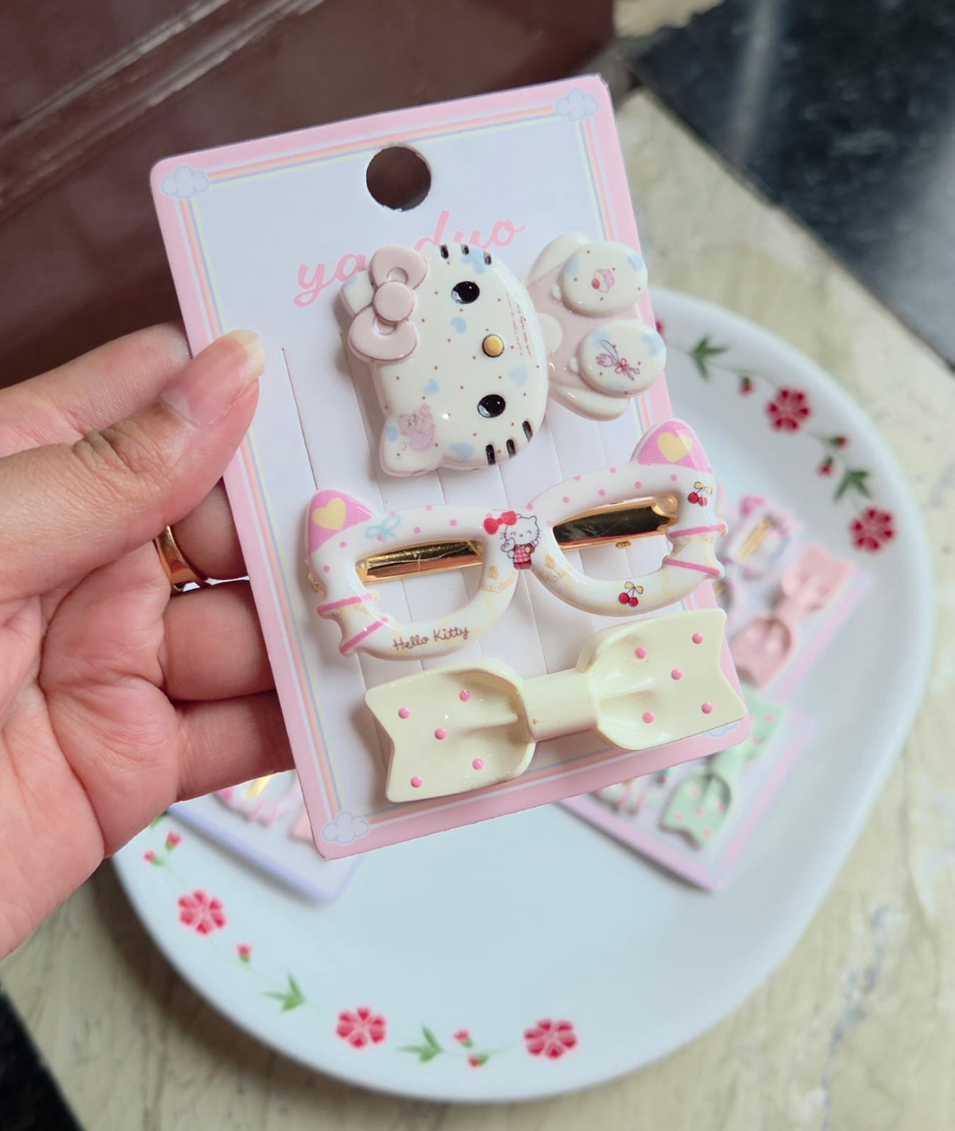   Cream and yellow cute character hair clips pack showing all 3 coordinated clips on packaging card.
