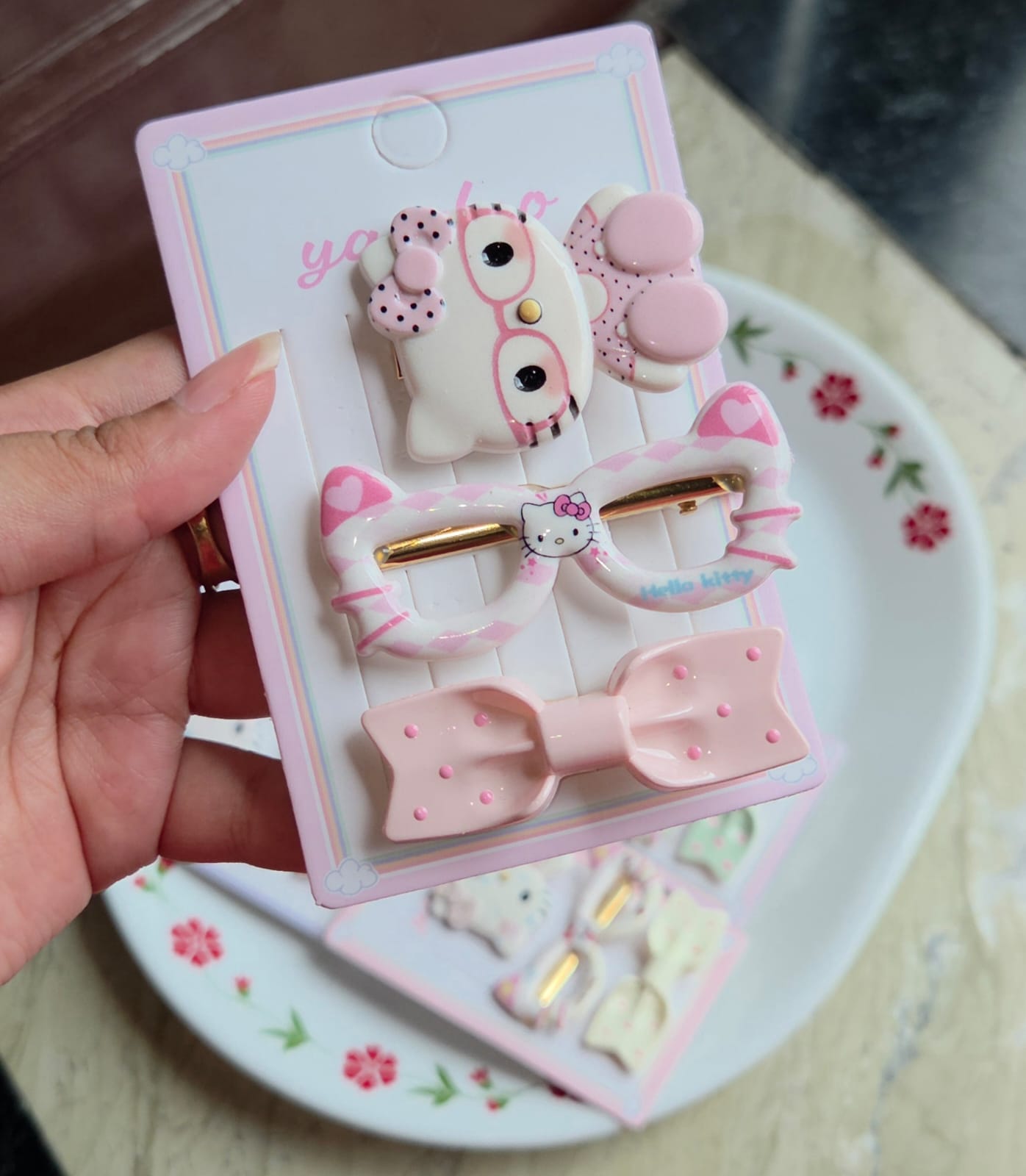    Pastel pink character hair clips set of 3 including bow pin and cute character design for girls.
