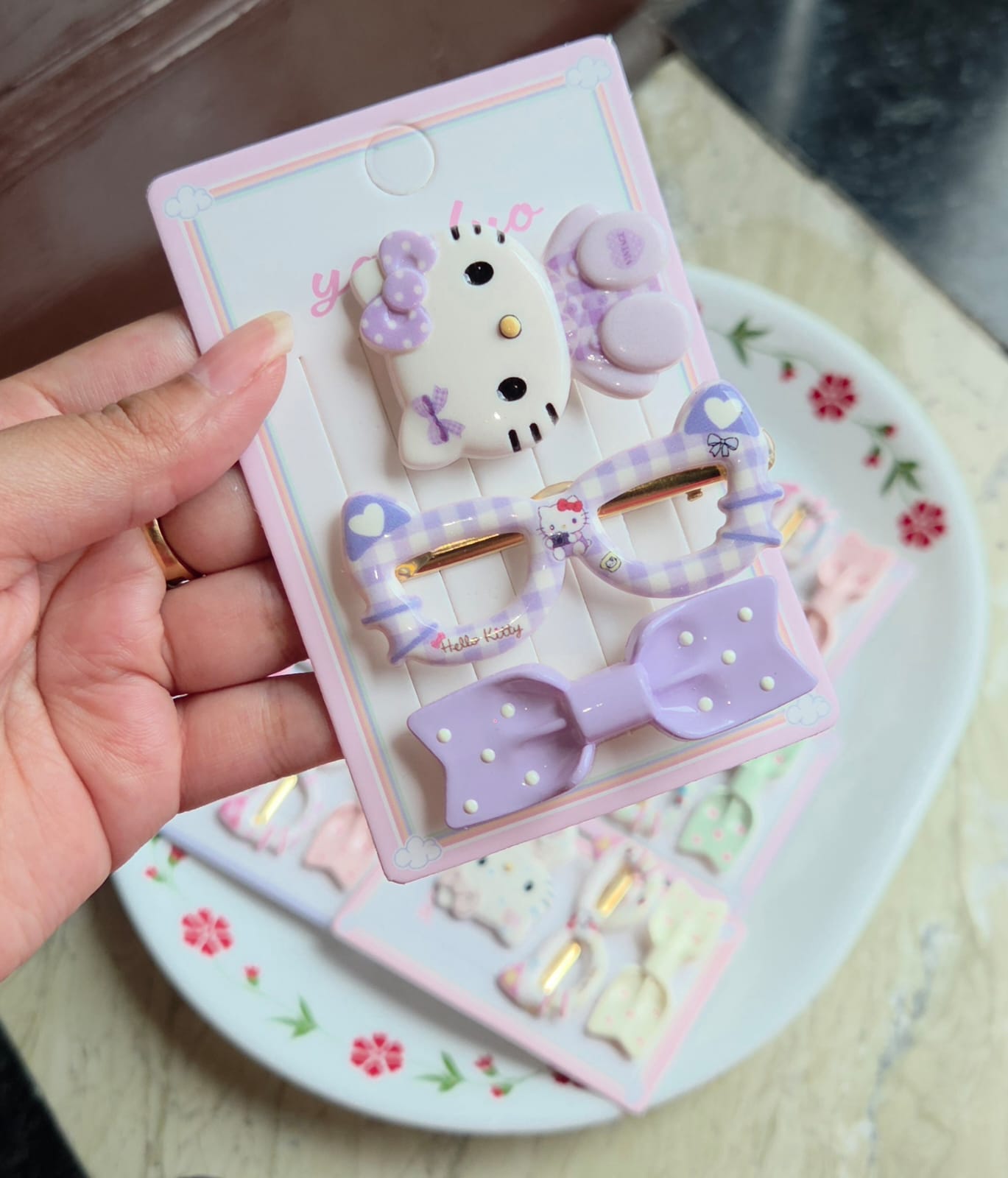    Set of 3 purple kawaii character hair clips featuring bunny ears, plaid pattern pin, and a purple bow.
