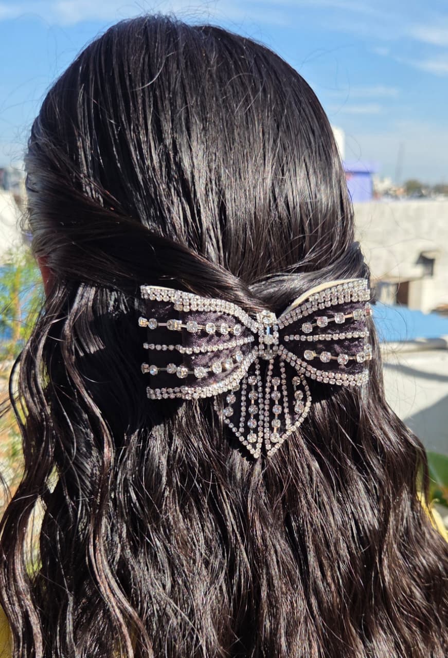 Elegant black rhinestone bow hair clip with crystal detailing and buckle back by PitilyPops