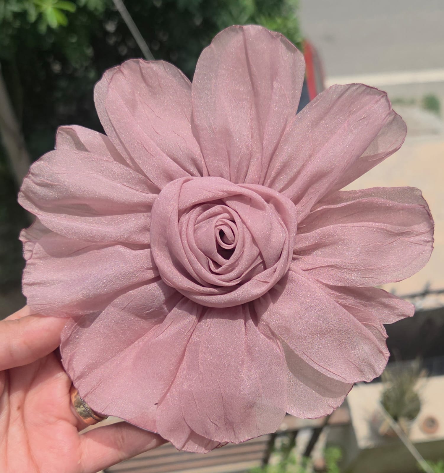    Dusty mauve large fabric flower hair clip with layered chiffon petals and an alligator clip backing.
