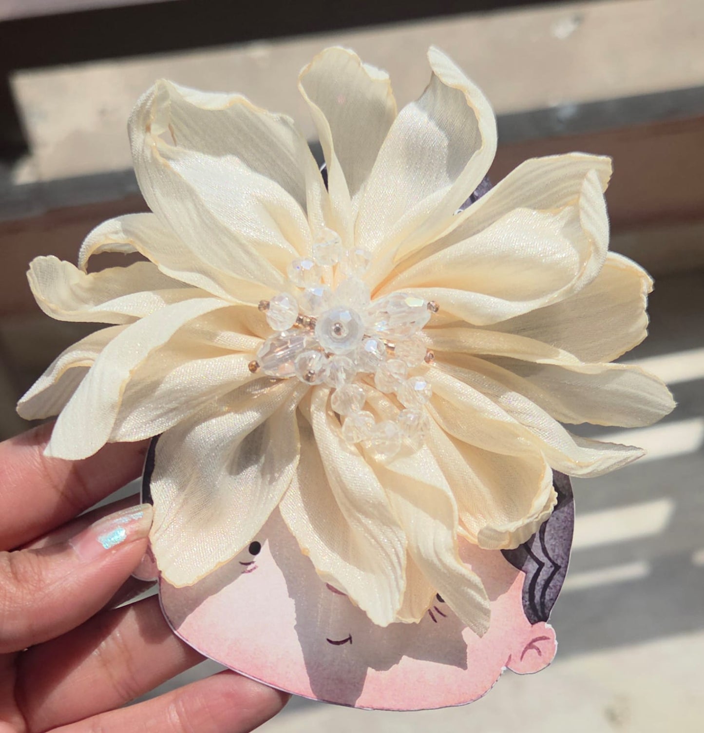 Handcrafted ivory white fabric flower hair clip with a clustered pearl and crystal bead centerpiece.