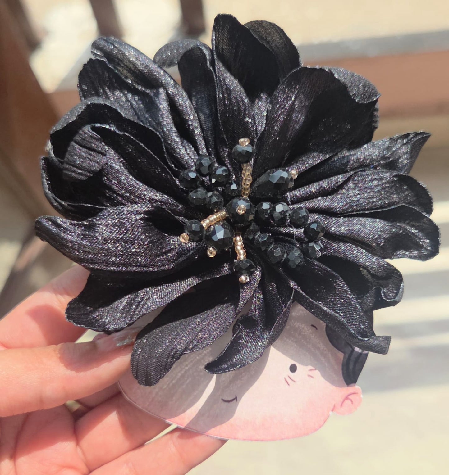 Midnight black floral alligator hair clip featuring an elegant dark crystal centerpiece for a secure hold.