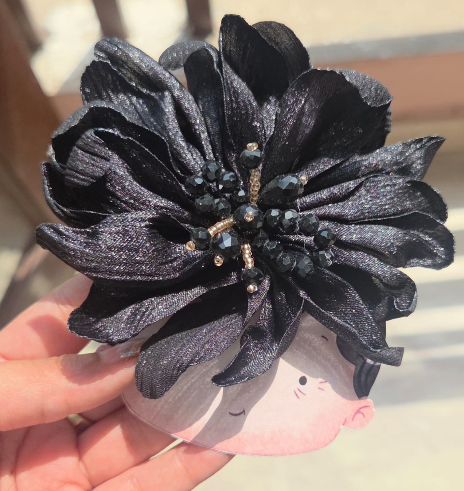 Midnight black floral alligator hair clip featuring an elegant dark crystal centerpiece for a secure hold.