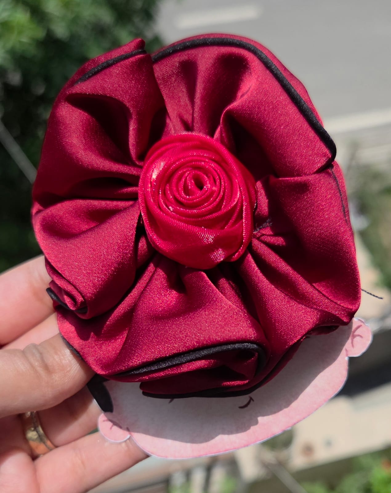 Dark red burgundy and classic black fabric flower hair clips for elegant hairstyles.