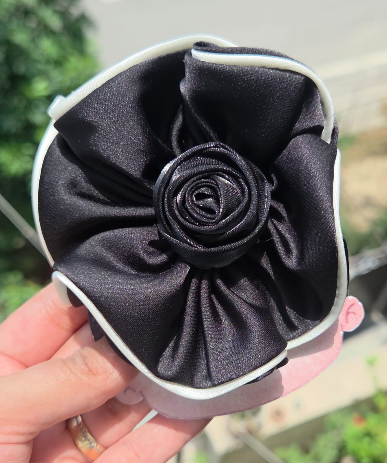 Oversized fabric rosette hair clips in pink, burgundy, black, cream white, and champagne beige.