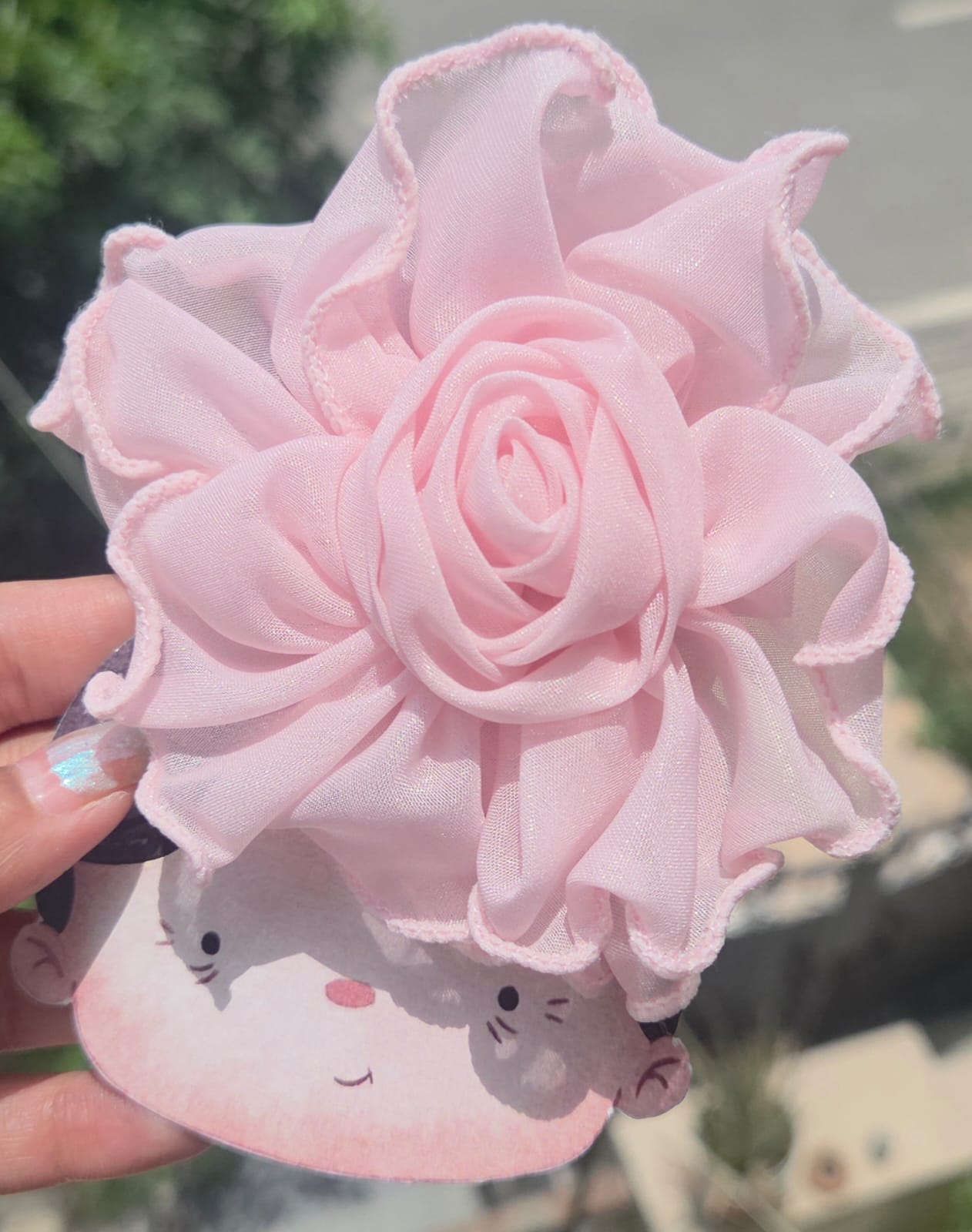 Blush pink ruffled fabric flower hair clip, perfect bridesmaid or toddler hair accessory.