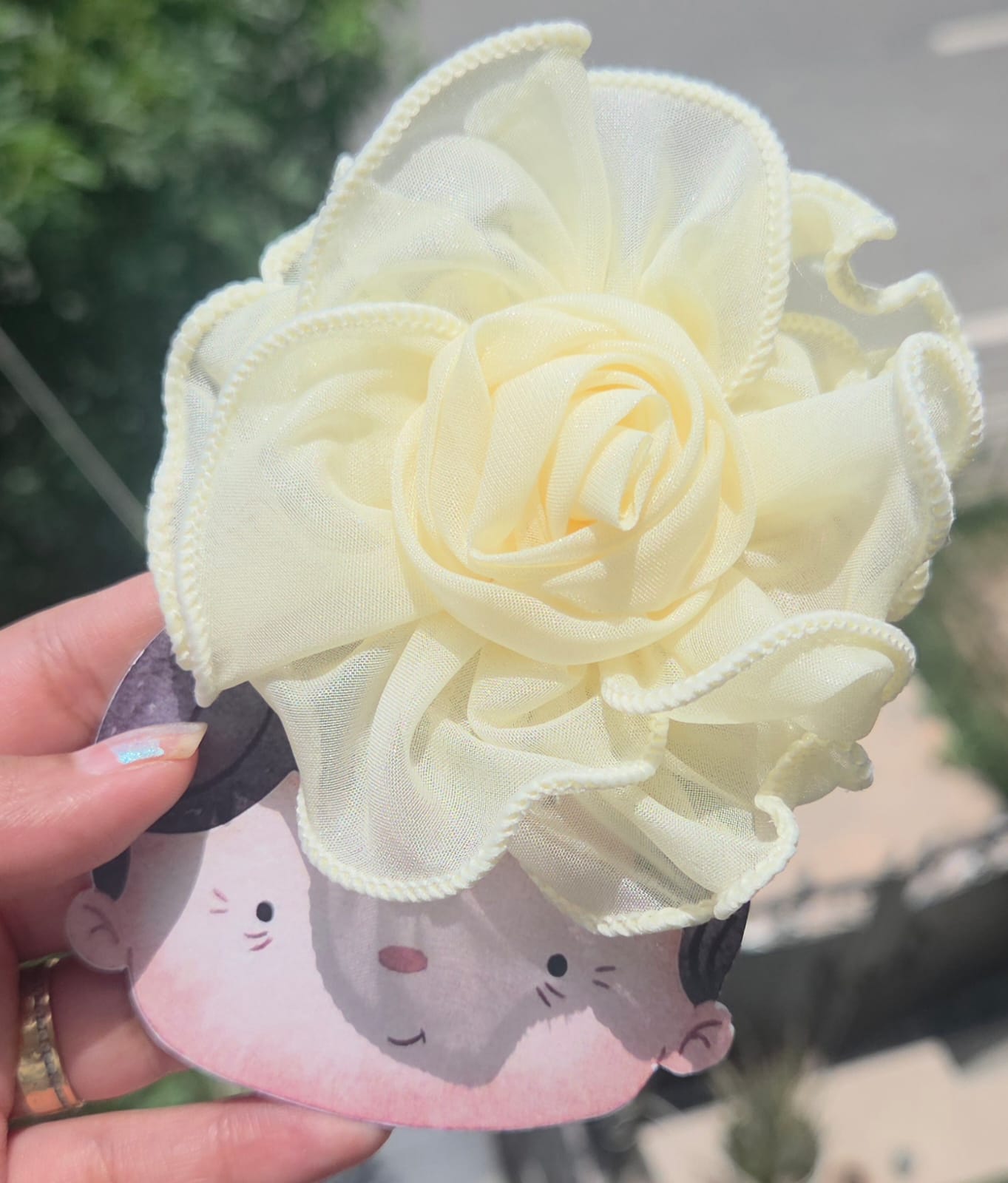 Light pastel yellow 3D fabric flower hair pin, bright and cheerful summer floral hair accessory.