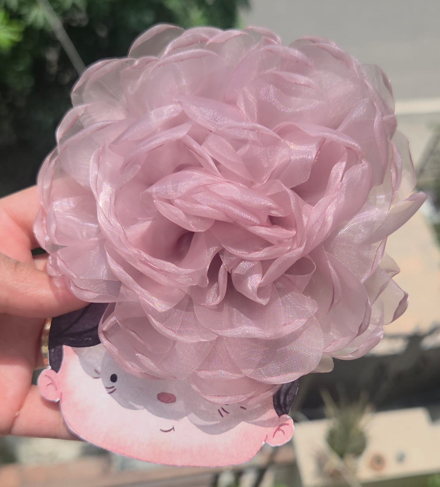 Muted dusty rose pink oversized organza flower clip for wedding or bridesmaid hair.