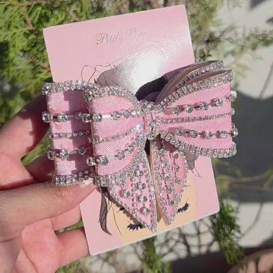 Elegant sparkly pink hair bow accessory for party and wedding hairstyles
