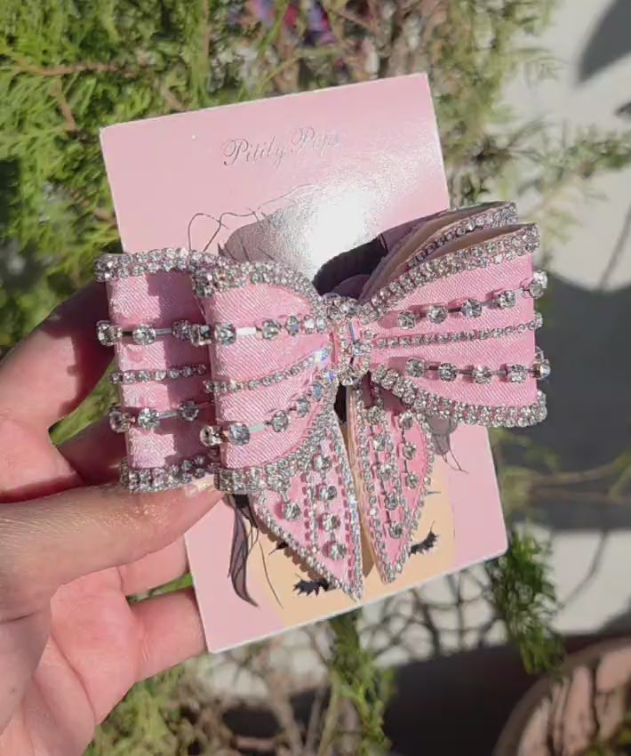 Elegant sparkly pink hair bow accessory for party and wedding hairstyles
