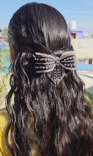 Stylish black satin bow hair accessory with premium rhinestone detailing and secure back buckle clip