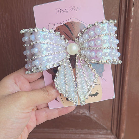 Pitily Pops luxury pearl rhinestone bow barrette in iridescent lavender fabric with center pearl detail for bridal and party styling