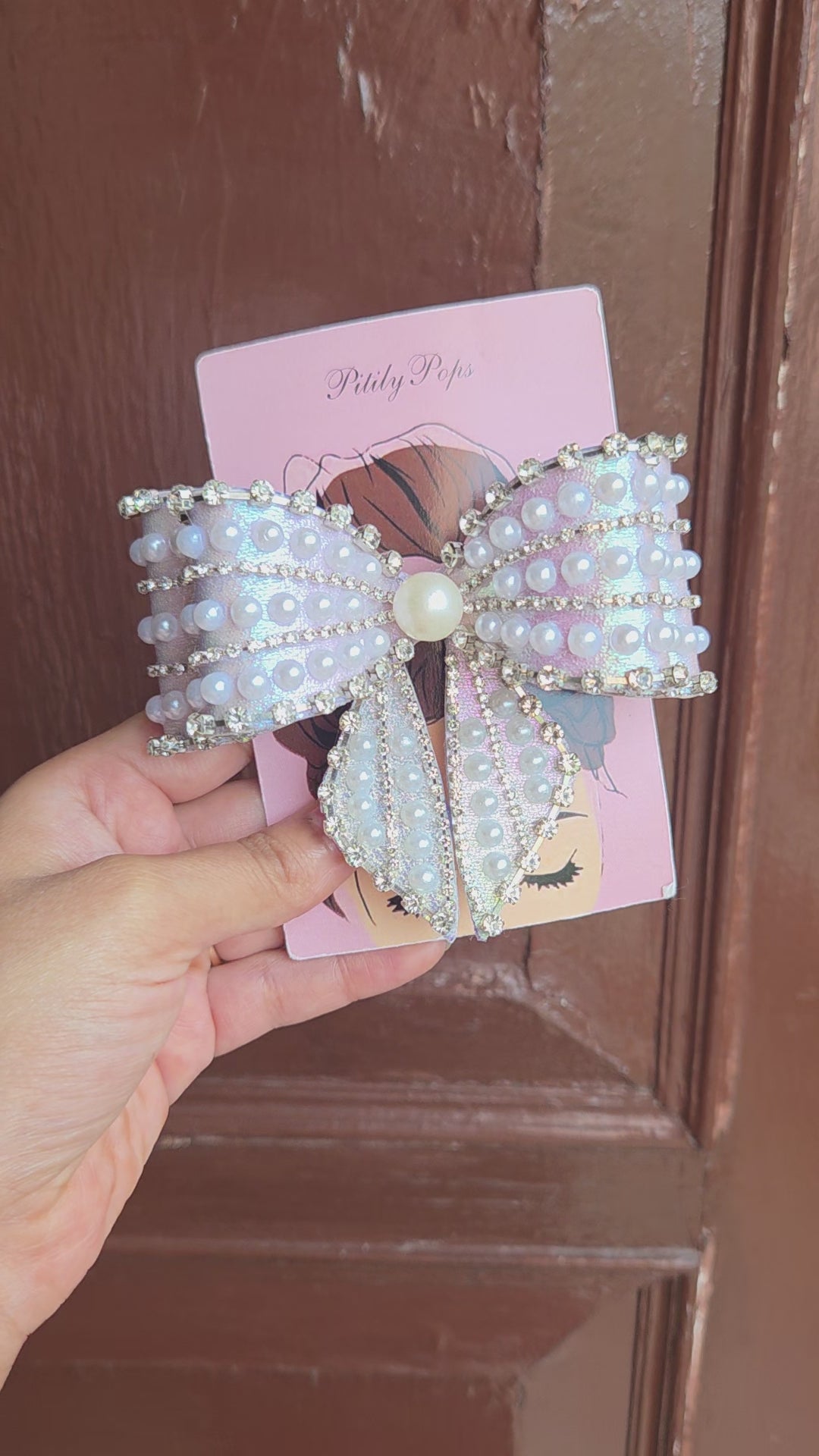 Pitily Pops luxury pearl rhinestone bow barrette in iridescent lavender fabric with center pearl detail for bridal and party styling