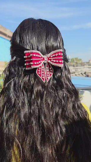 Elegant red crystal rhinestone bow hair clip with luxury handmade detailing and secure buckle clasp
