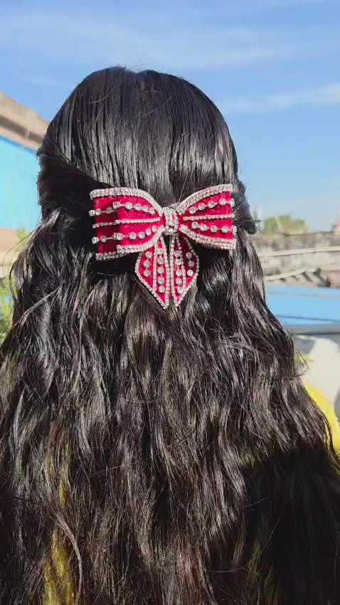 Elegant red crystal rhinestone bow hair clip with luxury handmade detailing and secure buckle clasp
