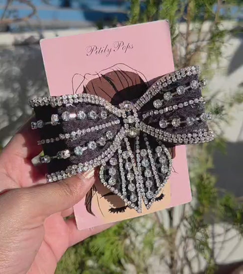 Handmade black crystal bow hair clip with sparkling rhinestone embellishments for women and girls
