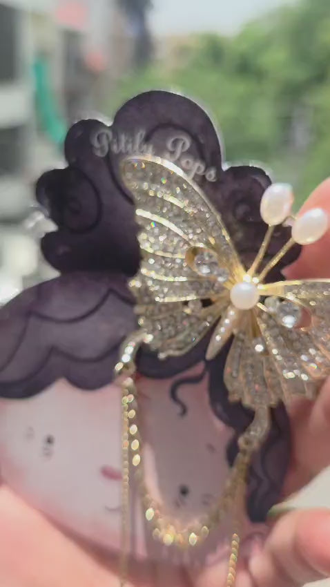 Elegant Korean-style crystal butterfly hair accessory featuring a secure alligator clip back and dual heart chain tassels