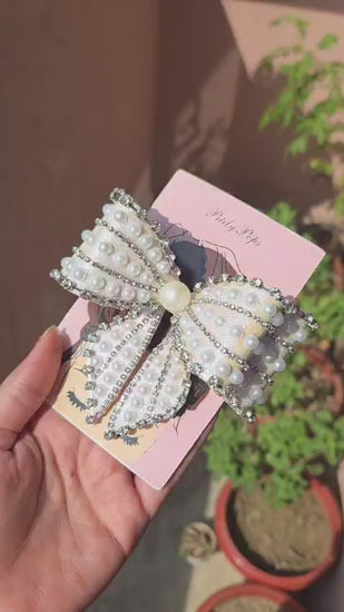 Luxury white shimmery bow barrette with faux pearl beads and crystal rhinestone trim on pink Pititly Pops gift card