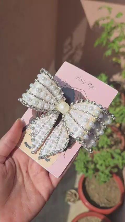 Luxury white shimmery bow barrette with faux pearl beads and crystal rhinestone trim on pink Pititly Pops gift card